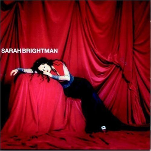 Sarah Brightman album cover, "Eden," with a woman reclining in red fabric.