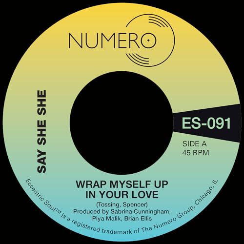 Vinyl record label with yellow-green gradient, black center hole, and text.