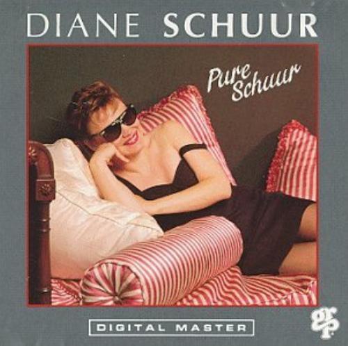 Diane Schuur album cover: woman in sunglasses lounging on pillows.