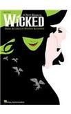 Sheet music cover for “Wicked” with green and white faces, black birds.