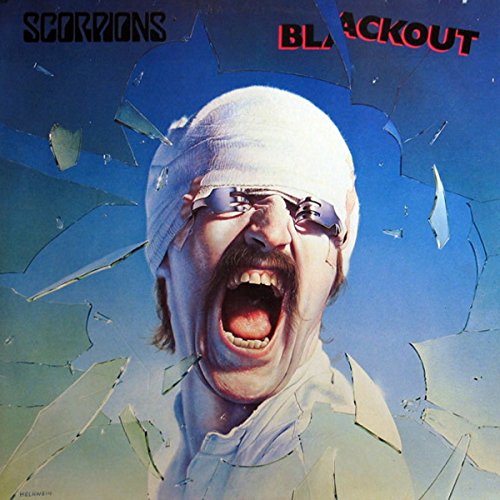 Album cover showing a man with a bandaged head and forks over his eyes.