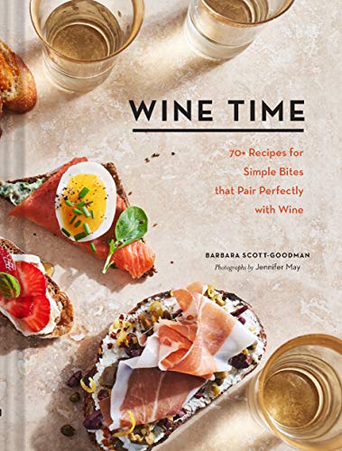 Cookbook cover with wine glasses and open-faced sandwiches.
