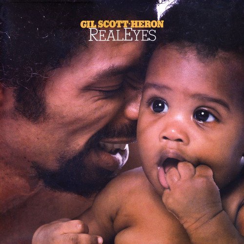 Album cover: Gil Scott-Heron with a baby, titled "Real Eyes".