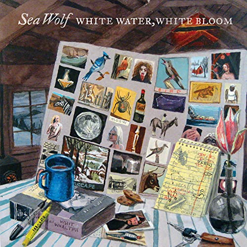 Album cover showing a desk with a collage of images, a blue mug, and notebook.