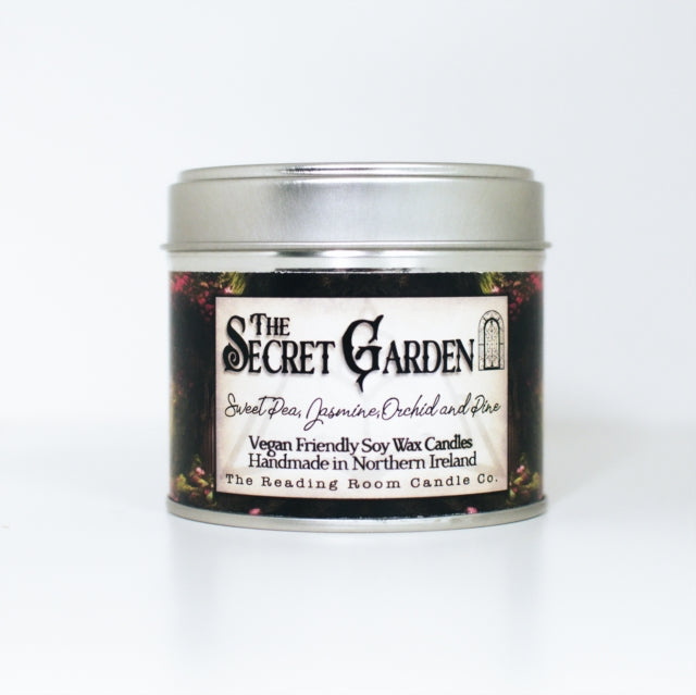 Silver tin candle with floral label reading "The Secret Garden".