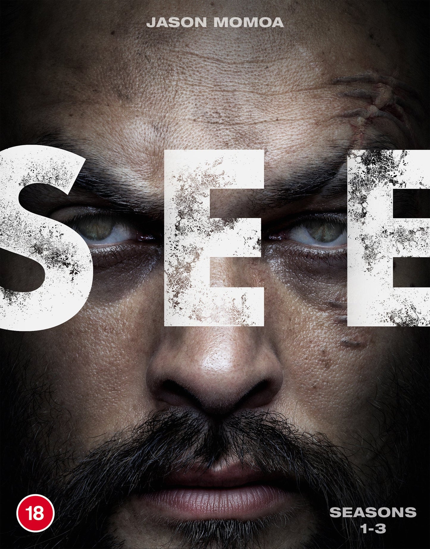Close-up of Jason Momoa’s face with large, textured “SEE” title lettering.