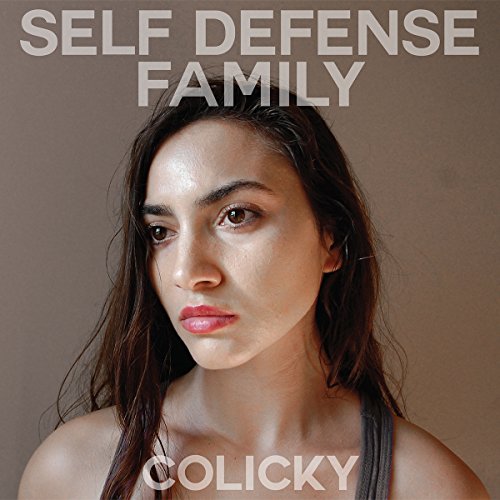 Album cover for Self Defense Family’s “Colicky” featuring a woman’s portrait.