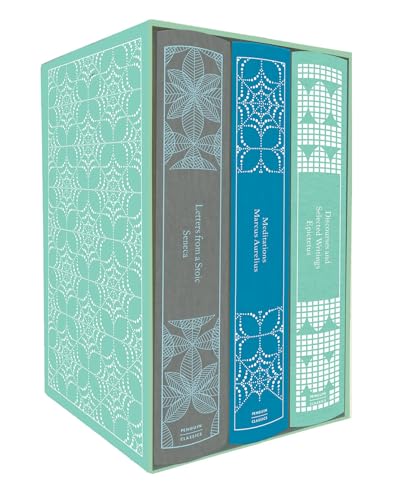 Boxed set of four antique-style books with patterned covers.