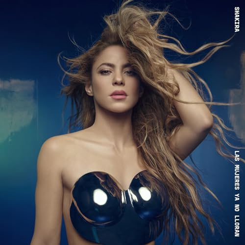 Shakira portrait with flowing hair, wearing a black strapless top.