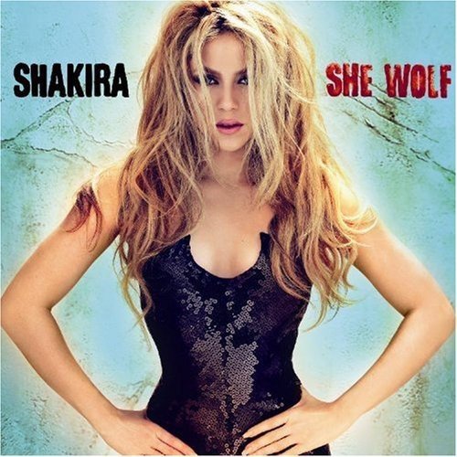 Shakira album cover, "She Wolf," featuring the artist with long blonde hair.