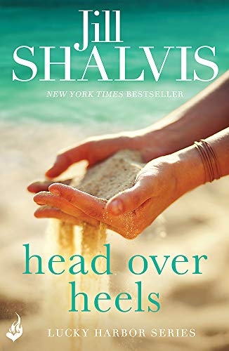 Book cover: hands holding sand, teal background, title "head over heels".