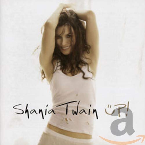 Shania Twain posing with hands behind her head on the Up! album cover.