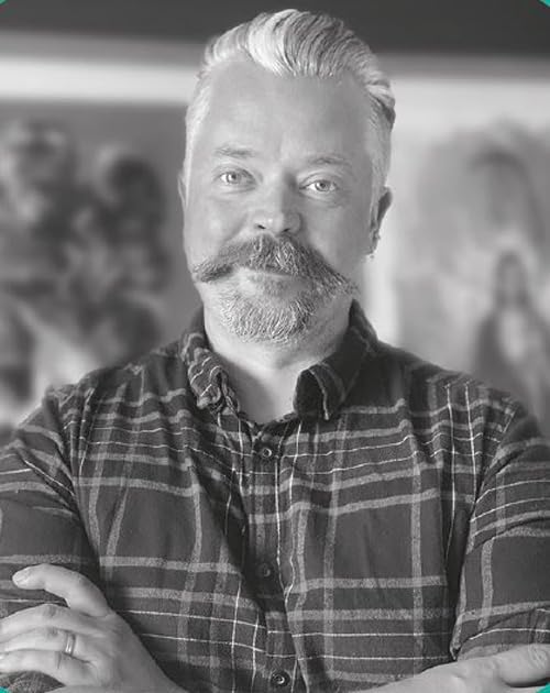 Black and white portrait of a man with a mustache and plaid shirt.