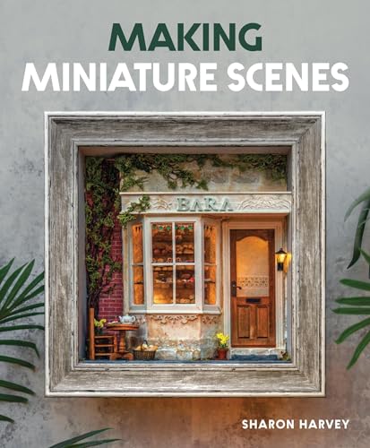 Book with miniature scene photographs and crafting instructions for dioramas and models.