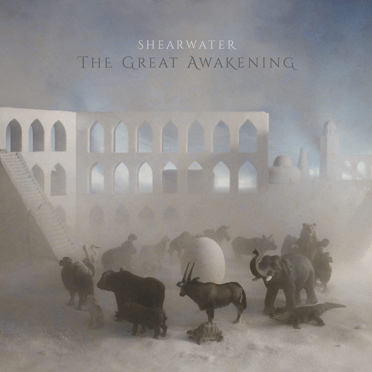 CD cover: animals and architecture in a misty, dreamlike landscape.