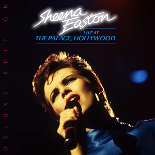 Sheena Easton singing into a microphone on a dark stage, album cover art.