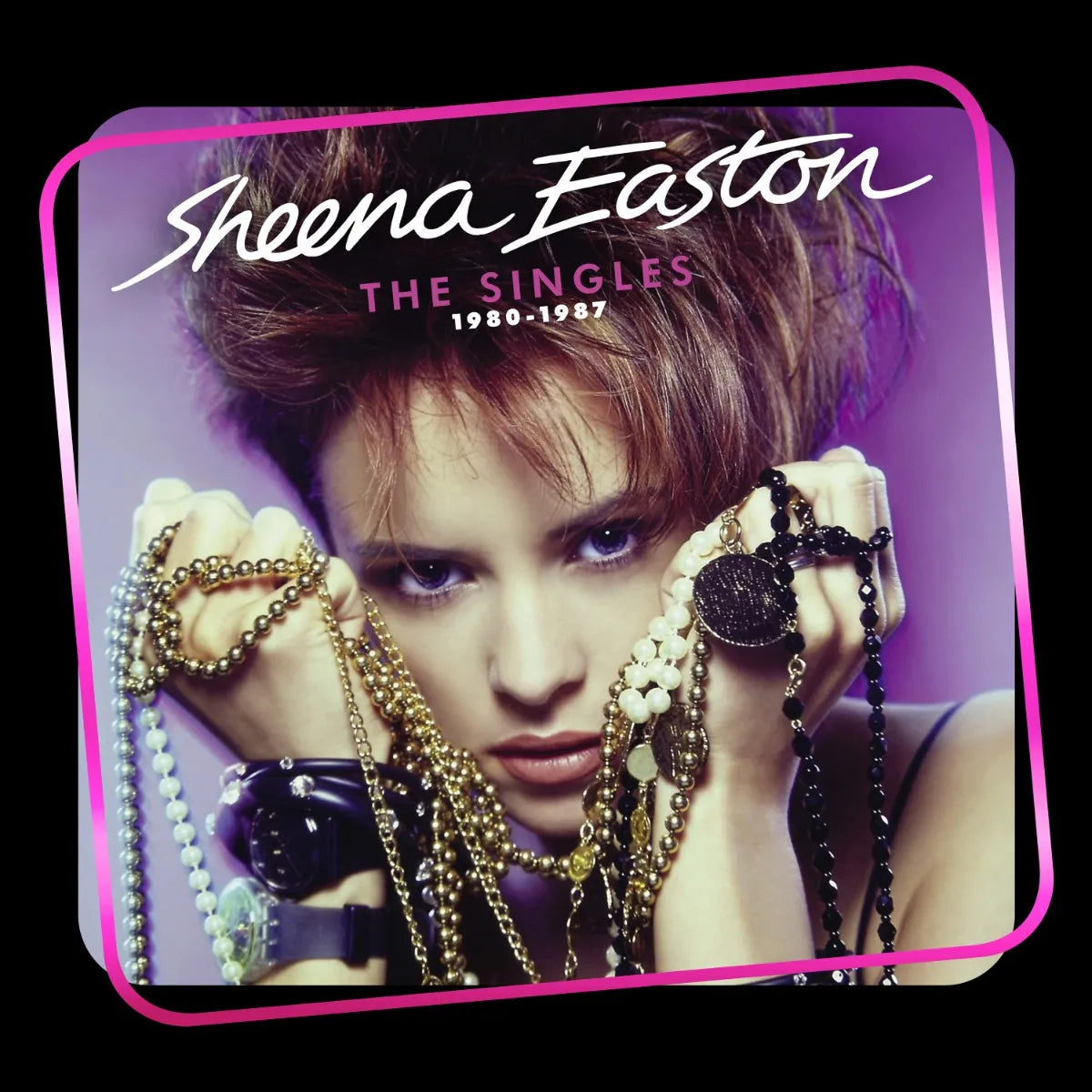 Sheena Easton album cover showing her holding strands of beads against a purple background.