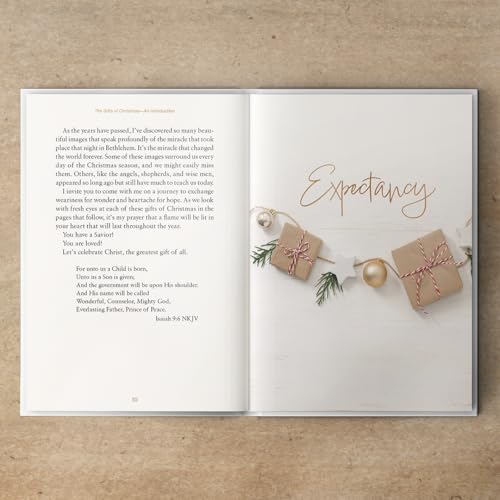 Open devotional book with text and small gift illustrations.