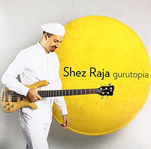 "Vinyl record titled 'Shez Raja - Gurutopia' with circular label and black disc."