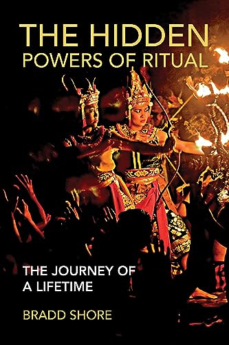 Book cover featuring dancers in ornate costumes with fiery background.