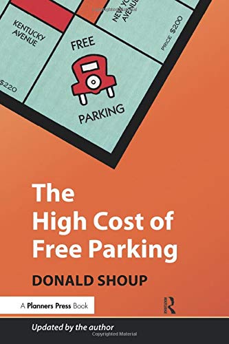 Book cover: "The High Cost of Free Parking" with a red car on a game board.