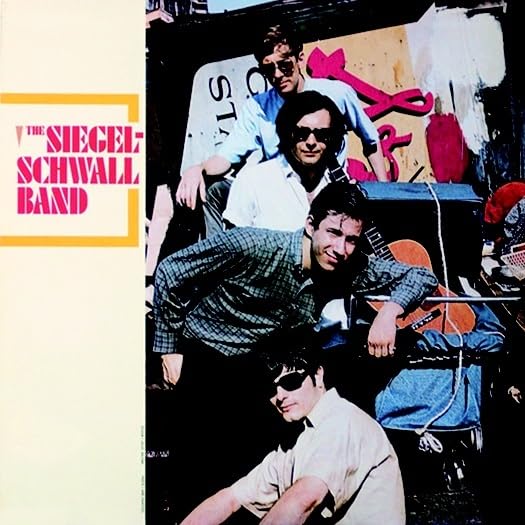 The Siegel-Schwall Band’s 1966 album cover featuring four men with instruments.