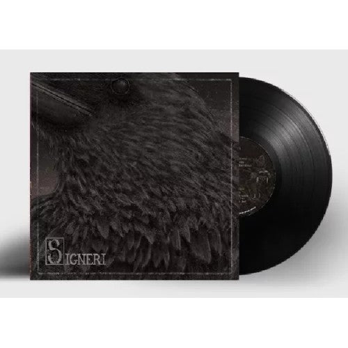 Vinyl record with black cover featuring a close-up of a raven’s face.