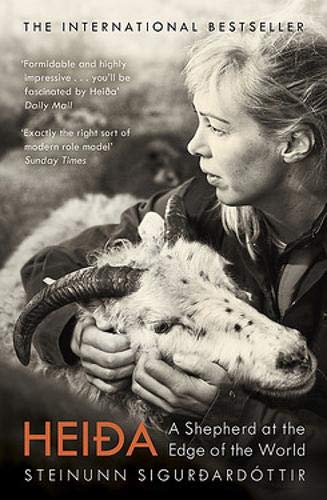 Black and white book cover showing a woman holding a horned sheep.