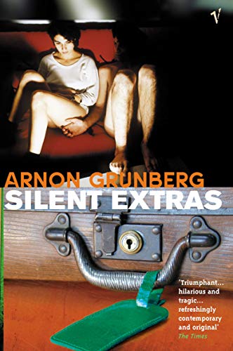Book cover: "Silent Extras" with a couple seated on a trunk.