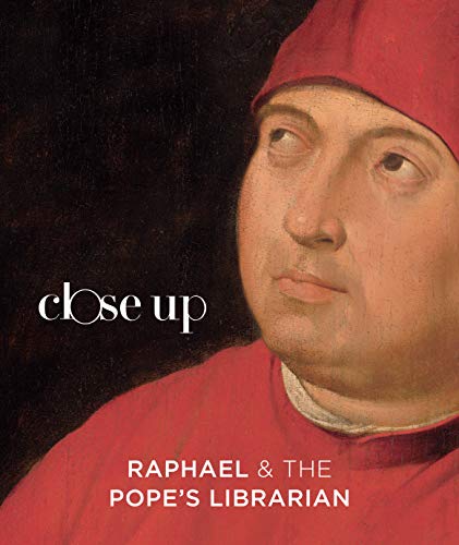 Close-up portrait of a man in a red hat and robe.