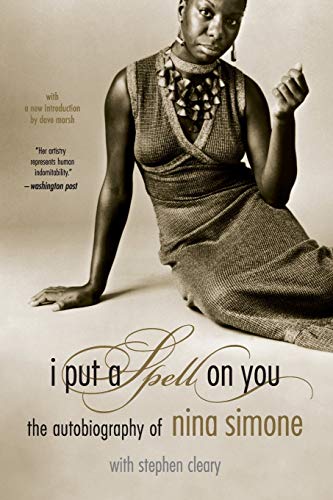 Sepia-toned portrait of Nina Simone wearing a textured dress and necklace on book cover.