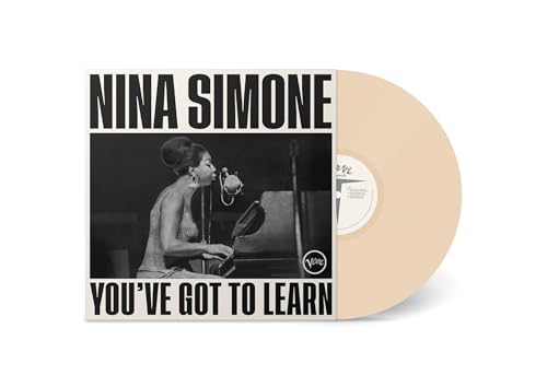 Nina Simone album cover and tan vinyl record, side view.