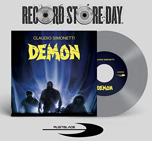 Demon" vinyl record and disc with shadowy figures on cover art.