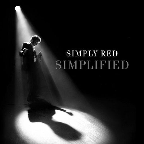 Black and white album cover featuring a man in a spotlight.