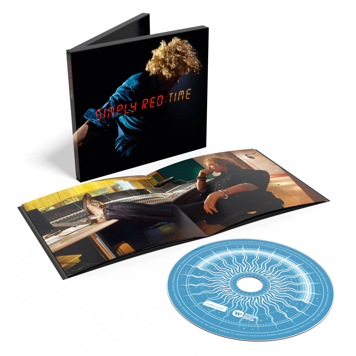 "CD case and disc for Simply Red's 'Time' album, featuring a man with curly hair."