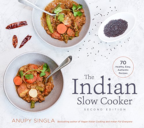 Cookbook cover featuring Indian food in bowls with spices around the edges.