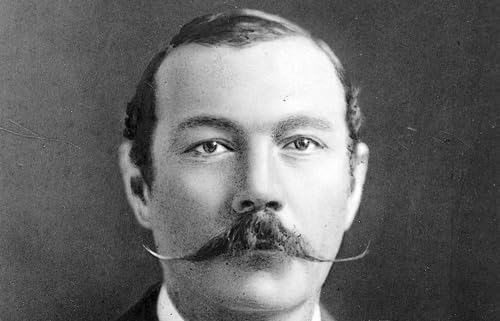 Black and white portrait of a man with a distinctive mustache.