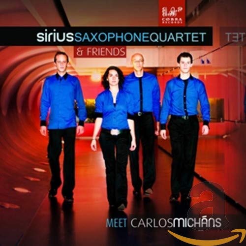 CD cover: Four people in blue shirts walking toward the viewer.