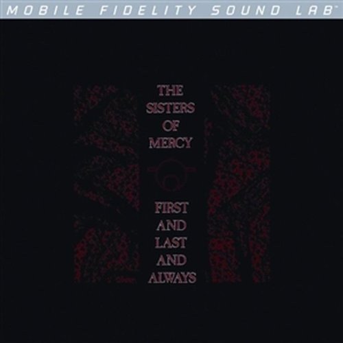 Black album cover with red floral designs and band name text.