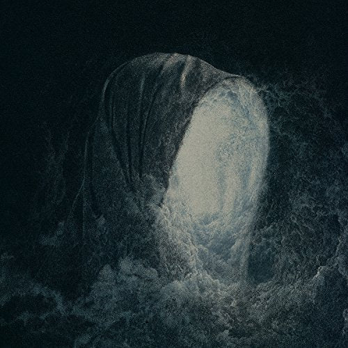 A dark, grainy image of a hooded figure with a glowing white face.