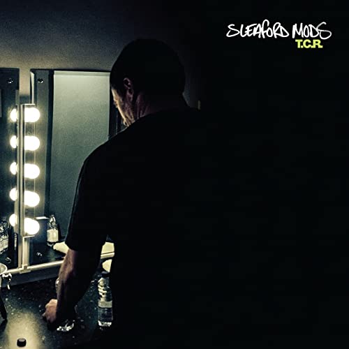 Sleaford Mods album cover: man’s back in front of a vanity mirror.