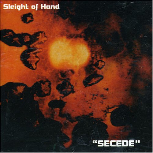 CD cover with abstract orange and black shapes, text at bottom.