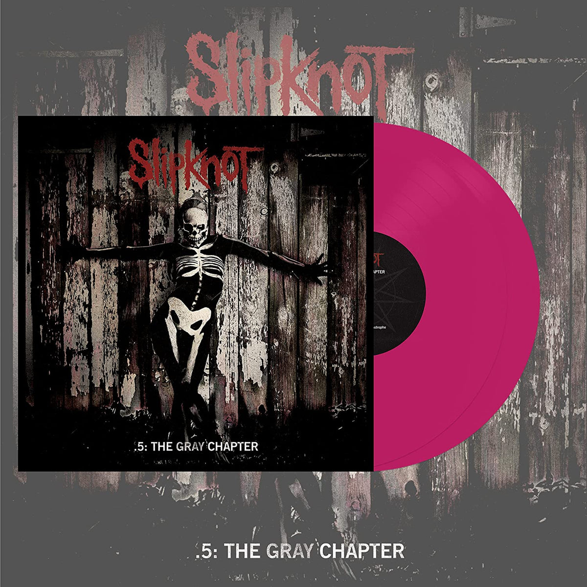 "Slipknot vinyl record with pink disc and album cover featuring a skeleton figure."