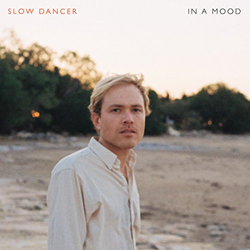 Album cover: portrait of a young man with blonde hair, outdoor setting.