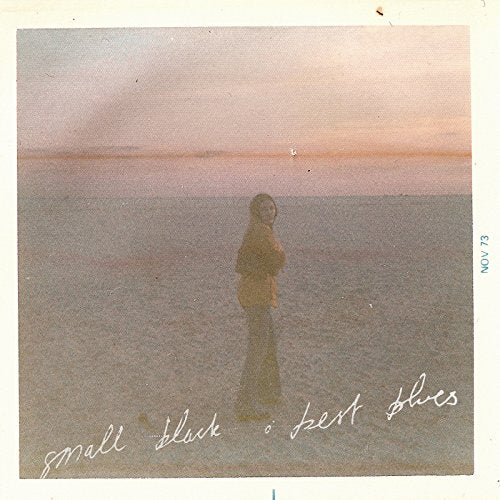 CD cover: lone figure on a beach, text "small black • best blues".