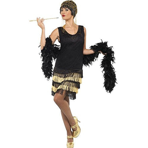 Woman in a black and gold 1920s flapper costume with fringe.