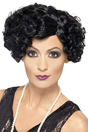 Woman wearing a short, curly black flapper wig.