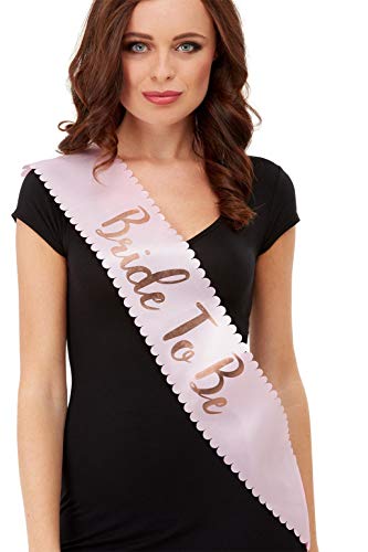 Woman wearing a pink and gold “Bride To Be” sash.