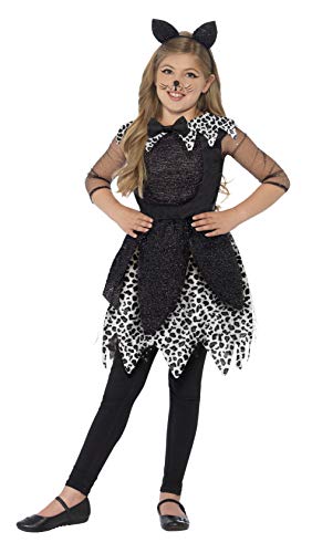 GirlLying girl wearing a black and white leopard print cat costume with ears.