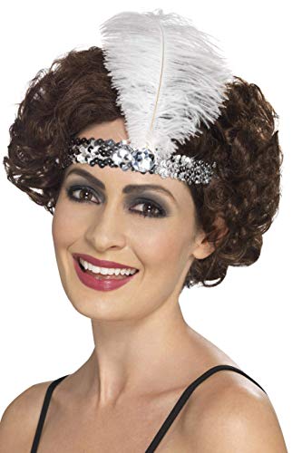 A woman wearing a silver sequined flapper headband with a white feather.